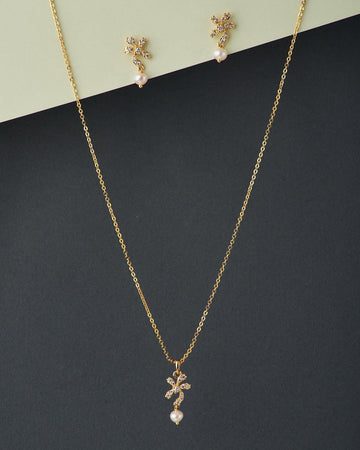 A cute pendant matched with golden polish chain with matching earrings. - Chandrani Pearls