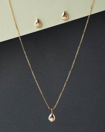 A cute pendant matched with golden polish chain with matching earrings. - Chandrani Pearls