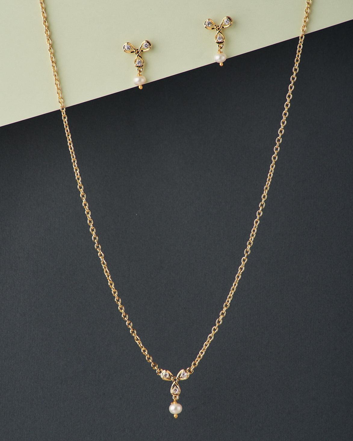 A cute pendant matched with golden polish chain with matching earrings
