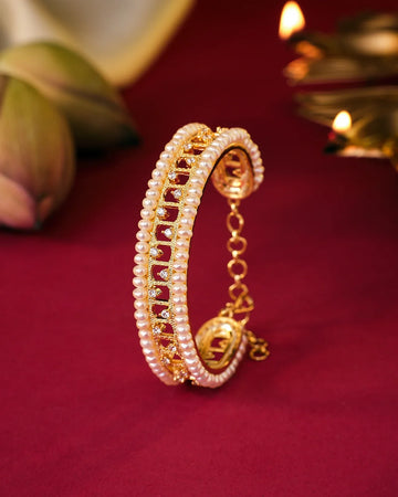 Elegant Gold Bangle with Double Rows of Pearls and Sparkling Stones