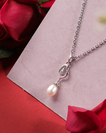 Chandrani Pearls India's Shining String 925 Silver Pendants feature a pearl and crystal accent, elegantly displayed on a light pink card with red roses—ideal for formal or casual occasions.