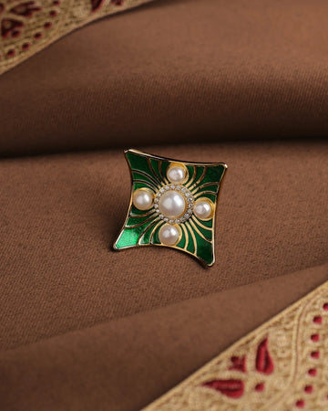The Rectangle-Inspired Pearl Ring with Filigree Detailing by Chandrani Pearls features five pearl accents and an antique-inspired design, making it a standout piece for elegant occasions.