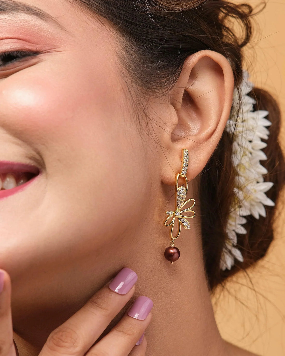 Prema raga- Love Colour Pearl Earrings by Chandrani Pearls, adorned with a floral design and pearl drops, displayed on red and blue boxes.