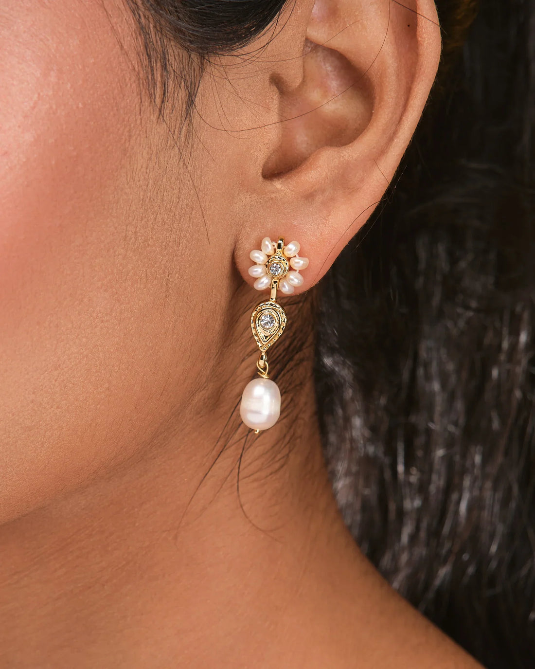 Chandrani Pearls' Classic Pearl & Cubic Zirconia Studs feature luminous pearls, CZ stones, and delicate white flower accents—an elegant choice to elevate your everyday style.
