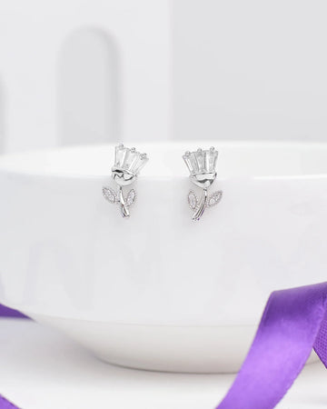 The Brunch Bloom CZ Silver Earrings by Chandrani Pearls feature flower-shaped silver designs with baguette-cut stones and leaf accents—ideal for adding a romantic touch to your casual weekend look.
