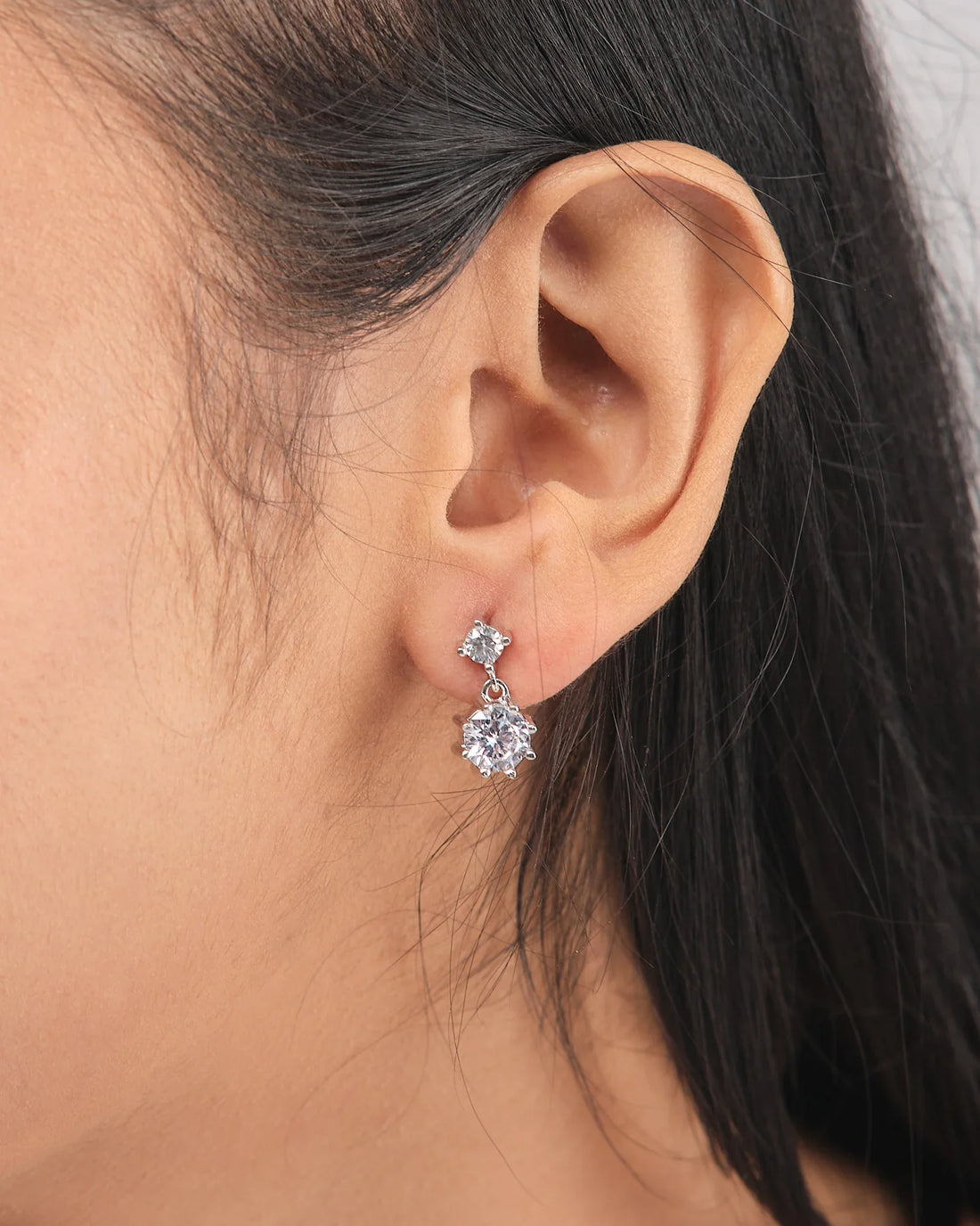 The Elegant Demifine Silver Earrings with Sparkling CZ Stones from Chandrani Pearls offer a refined touch, their shimmering CZ accents adding brilliance to any look.