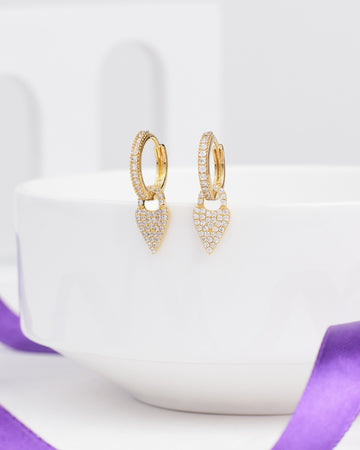 Chandrani Pearls' Teardrop CZ Earrings in Elegant Demifine Silver shown on a white dish, with a purple ribbon in the foreground.
