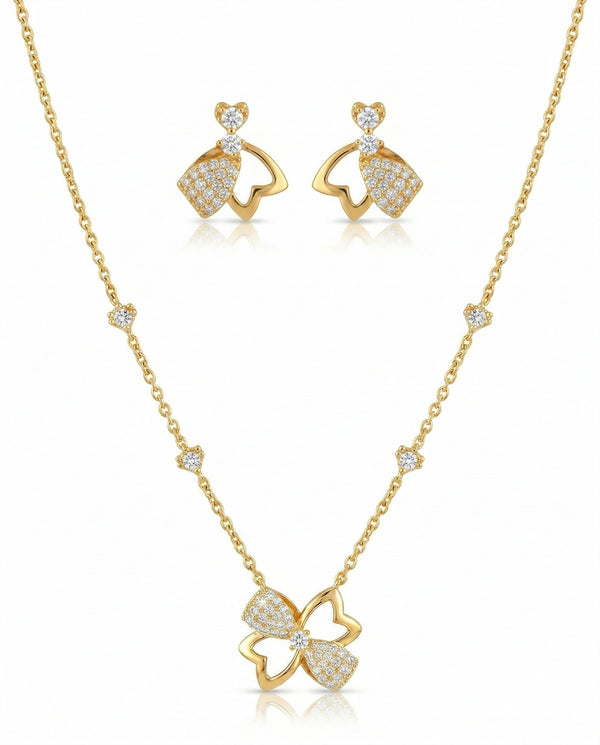 Gold necklace and earrings set on a white background