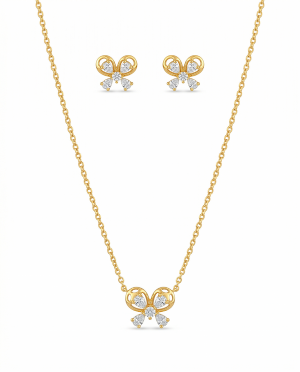 Gold butterfly necklace and earrings on a white background