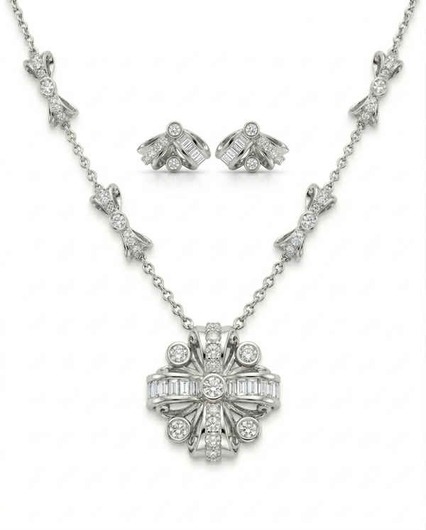 Silver necklace and earrings set on a white background