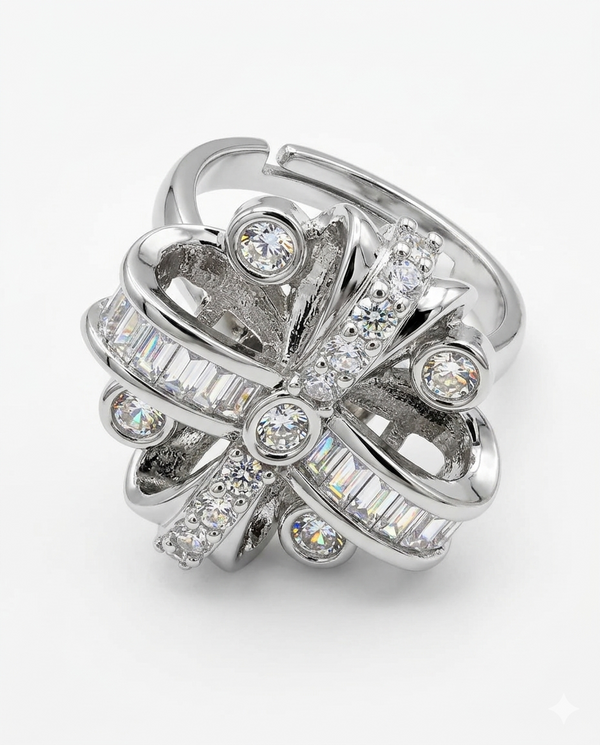 Silver ring with diamond accents on a white background