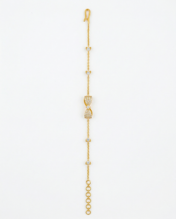 Gold bracelet with heart-shaped clasp on a white background