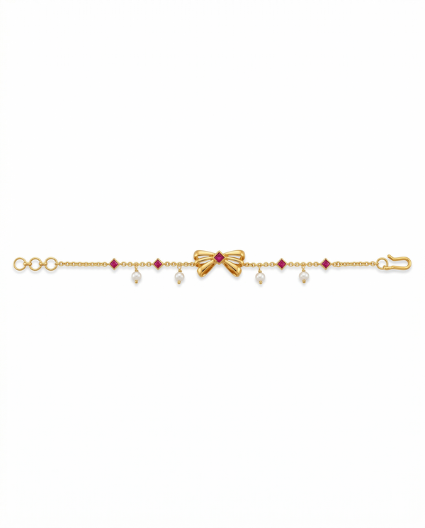 Gold bracelet with red gemstones and pearls on a white background