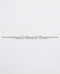 Silver bracelet with small beads on a light gray background