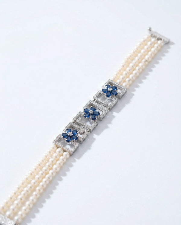 Elegant Triple-Strand Floral Pearl Bracelet
