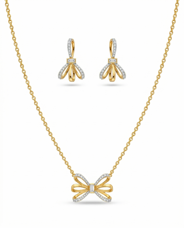 Gold necklace and earrings with bow design on a white background