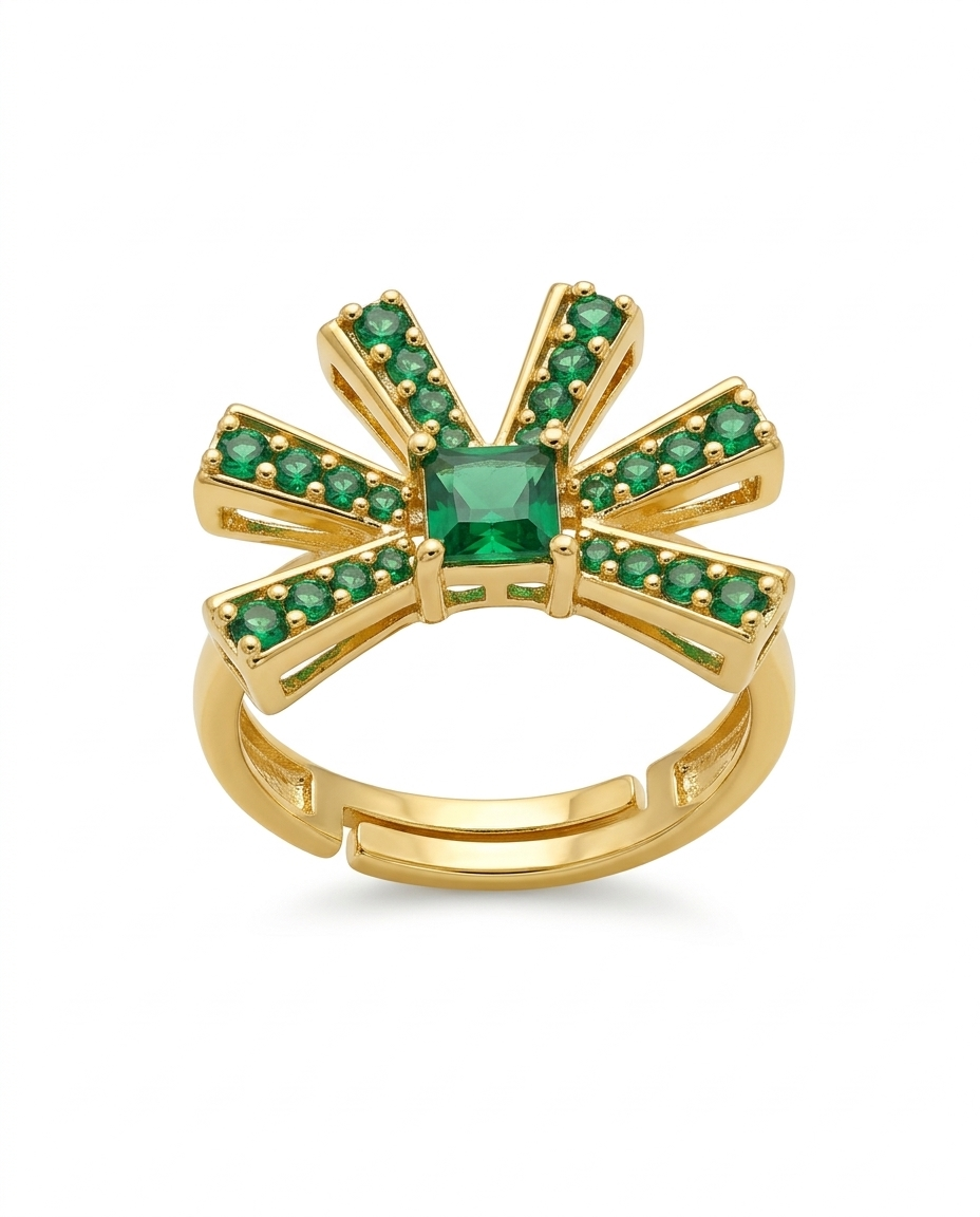 Gold ring with green gemstones on a white background