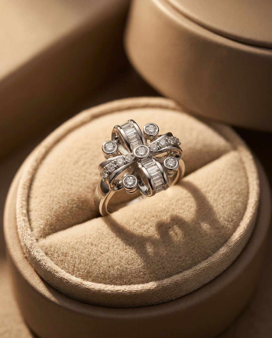 Silver ring with diamond accents on a white background