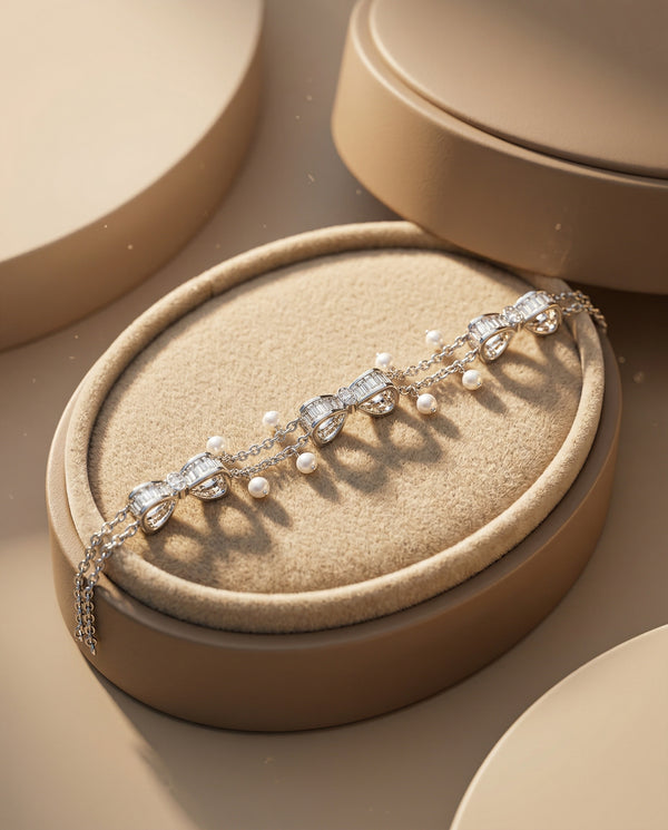 Silver bracelet with pearls on a beige jewelry display