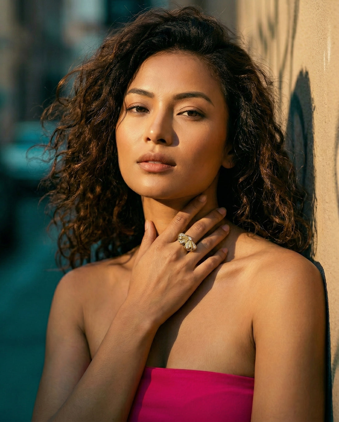 Gold ring with diamond accents on a white background