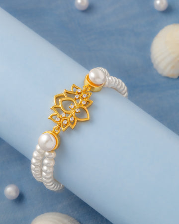 Elegant White Pearl Bracelet with Gold-Tone Floral Motif