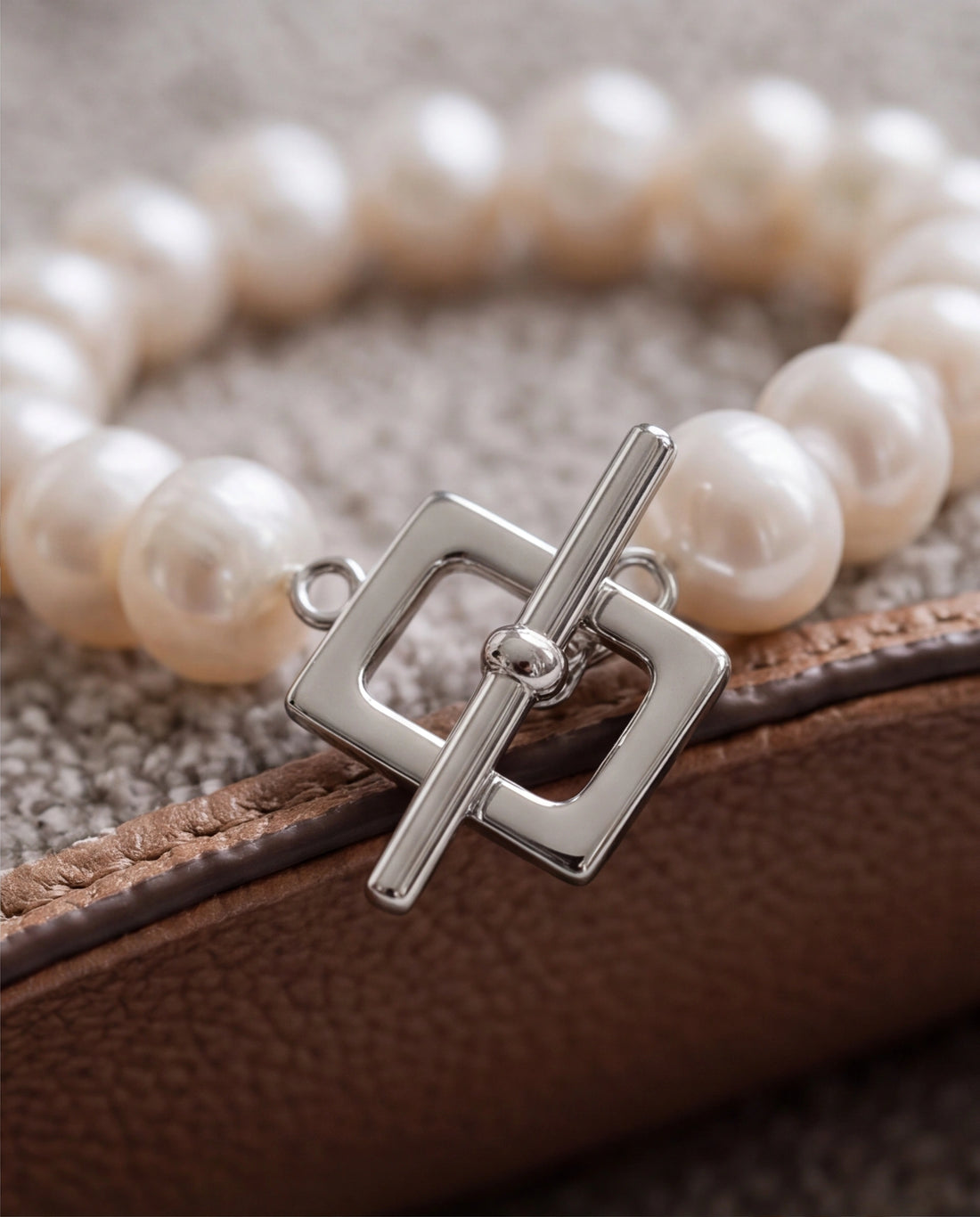 Lustrous Pearl Strand Bracelet with Silver Geometric Toggle Clasp