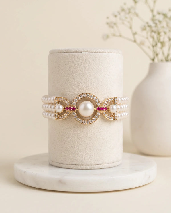 Three-Strand Pearl Bracelet with Circular CZ Centerpiece & Ruby Accents