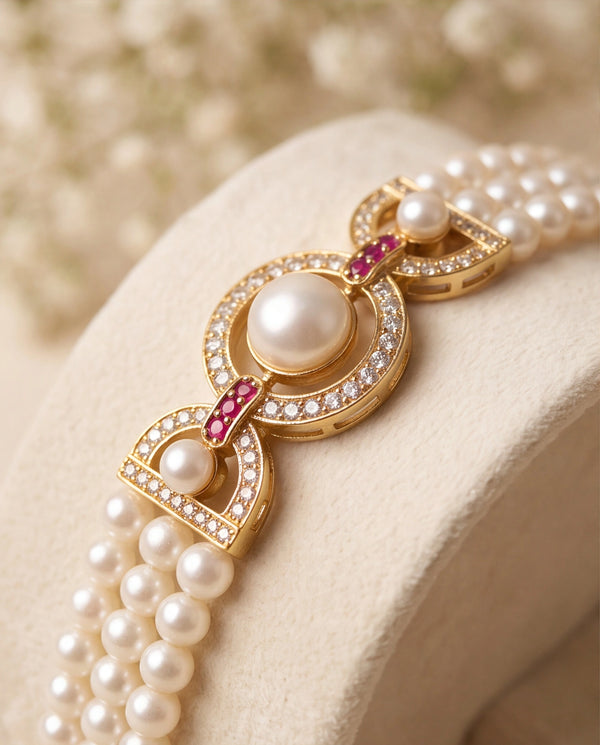 Three-Strand Pearl Bracelet with Circular CZ Centerpiece & Ruby Accents