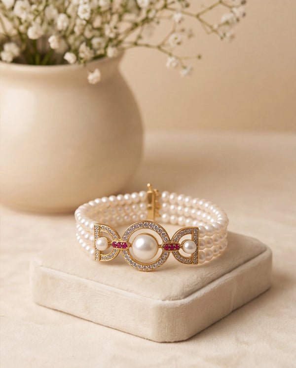 Three-Strand Pearl Bracelet with Circular CZ Centerpiece & Ruby Accents
