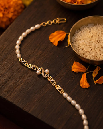 Gold-Plated Geometric Pearl & Cubic Zirconia Rakhi Cum Bracelet