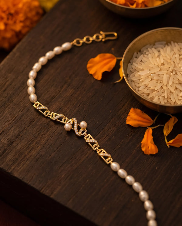 Gold-Plated Geometric Pearl & Cubic Zirconia Rakhi Cum Bracelet