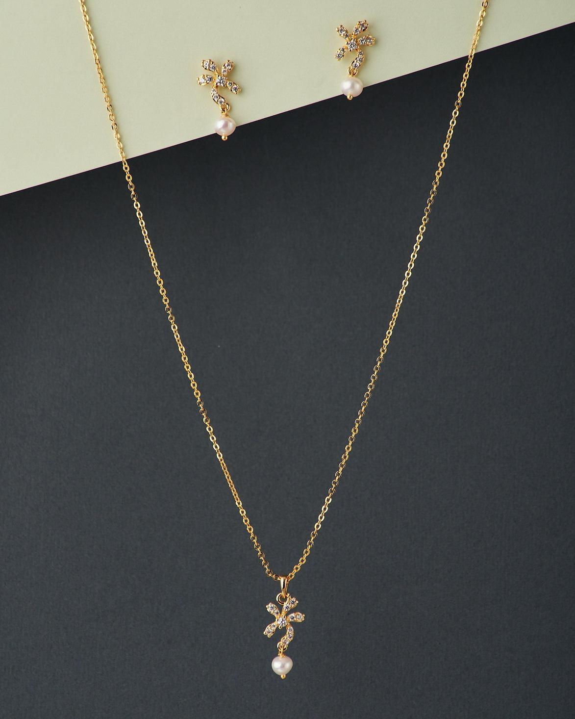A cute pendant matched with golden polish chain with matching earrings. - Chandrani Pearls