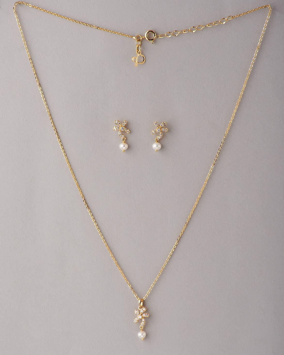 A cute pendant matched with golden polish chain with matching earrings. - Chandrani Pearls