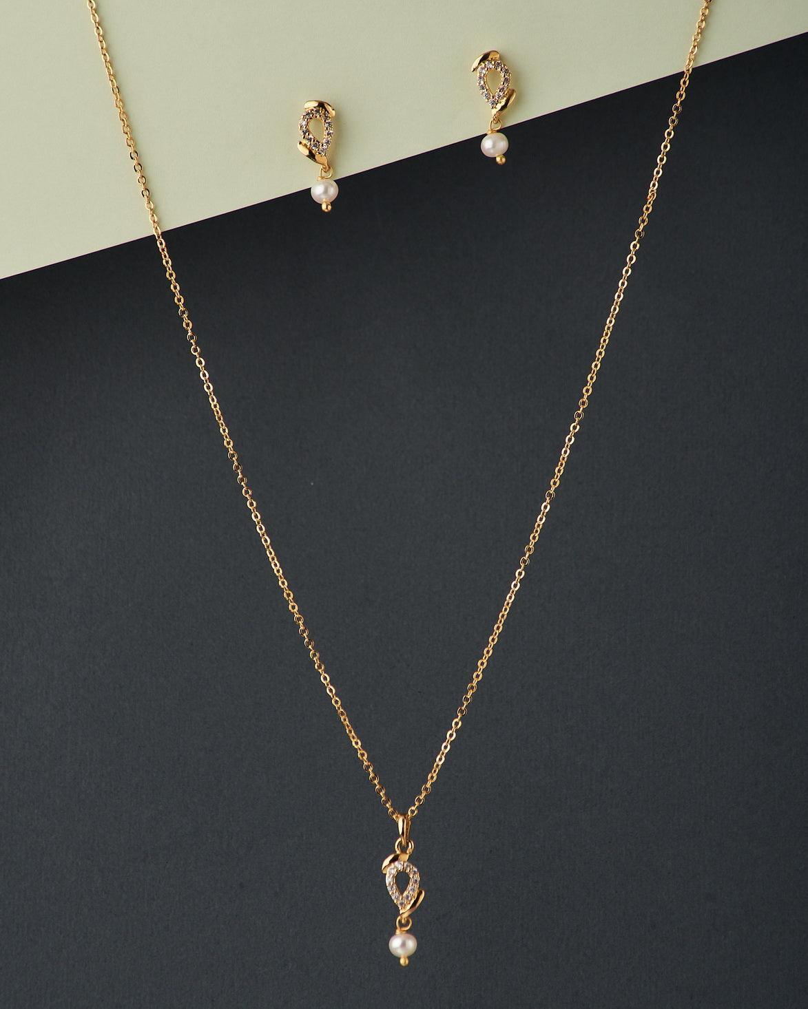 A cute pendant matched with golden polish chain with matching earrings. - Chandrani Pearls
