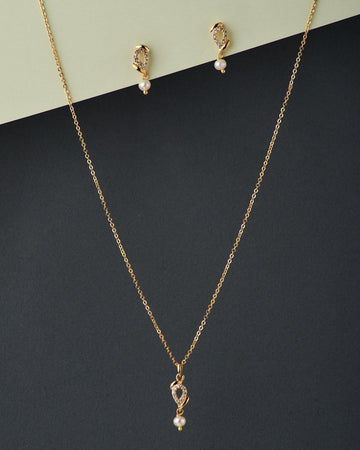 A cute pendant matched with golden polish chain with matching earrings. - Chandrani Pearls