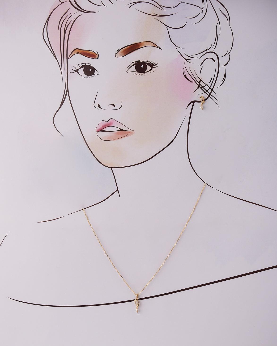 A cute pendant matched with golden polish chain with matching earrings. - Chandrani Pearls