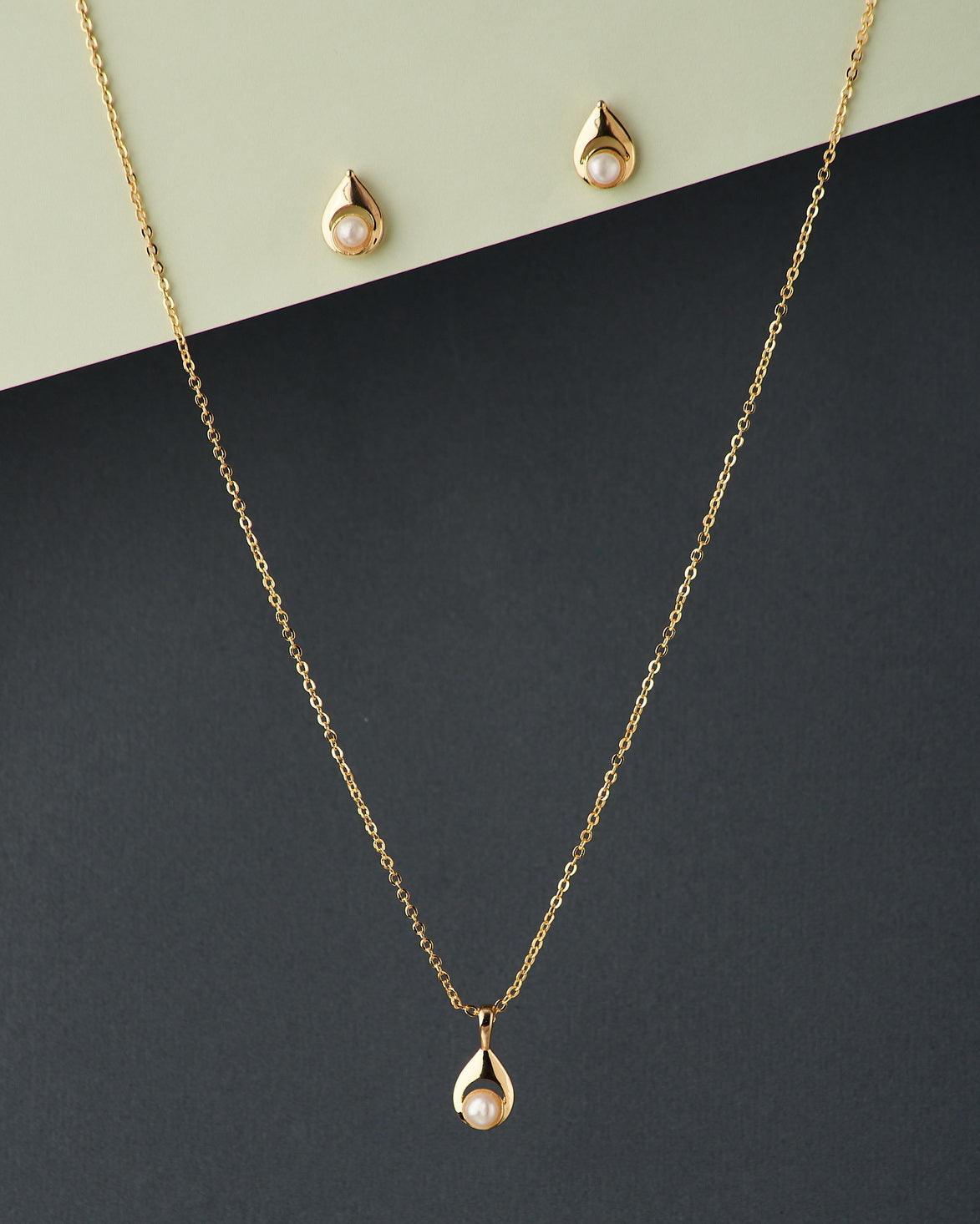 A cute pendant matched with golden polish chain with matching earrings. - Chandrani Pearls