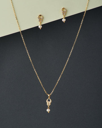 A cute pendant matched with golden polish chain with matching earrings. - Chandrani Pearls