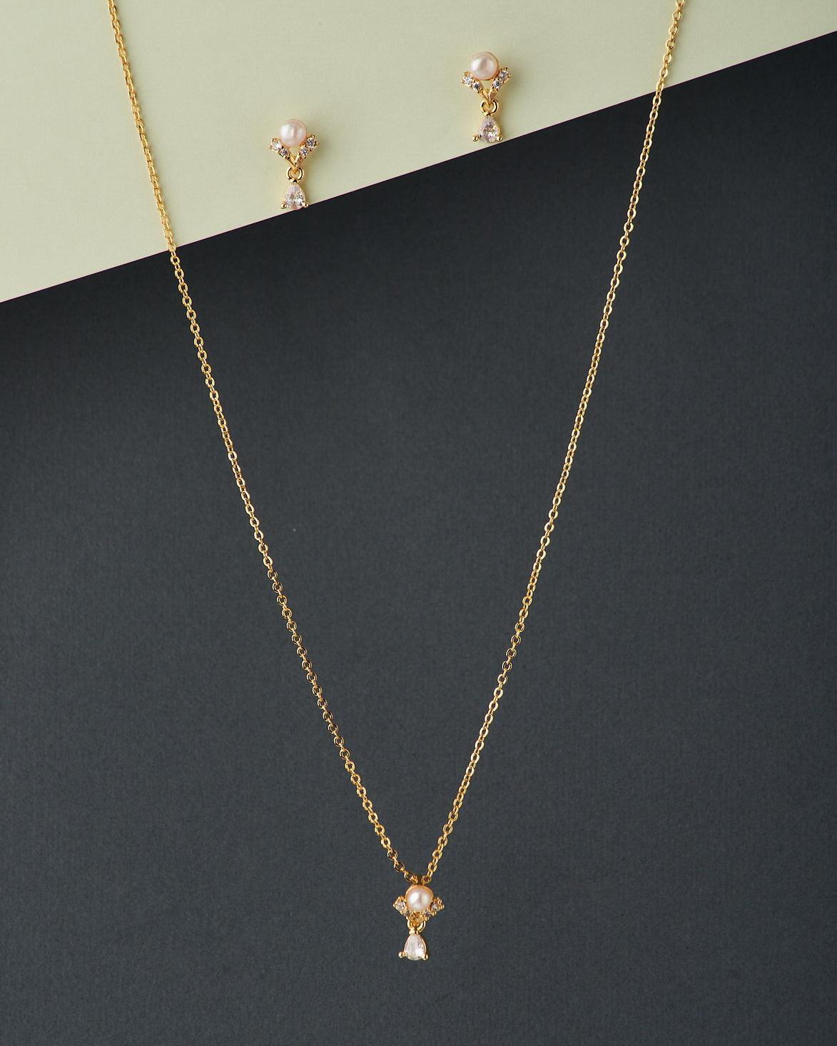 A cute pendant matched with golden polish chain with matching earrings. - Chandrani Pearls