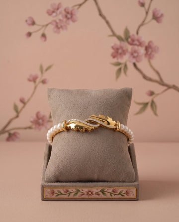 Gold Plated Pearl Bangle with CZ Leaf Accent Motif