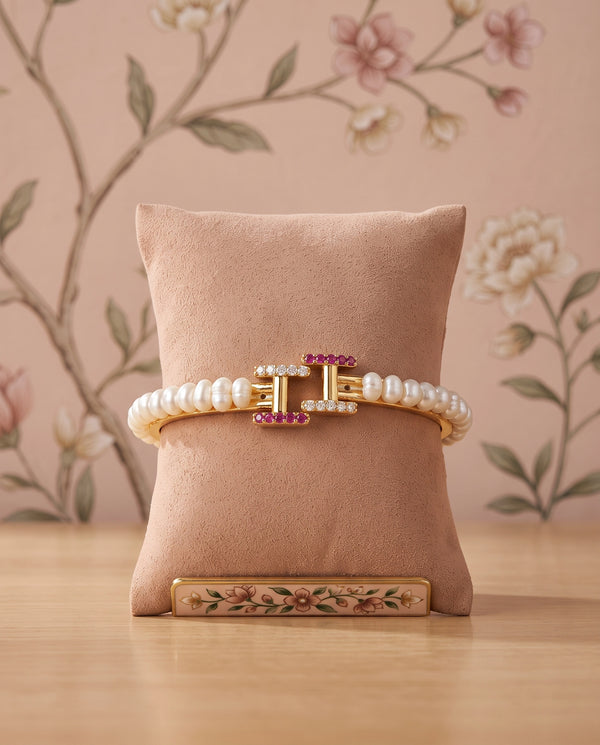 Gold-Plated Pearl Bangle with Geometric Ruby & CZ Buckle Motif