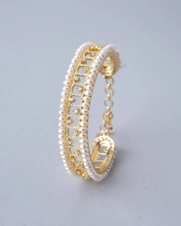 Elegant Gold Bangle with Double Rows of Pearls and Sparkling Stones