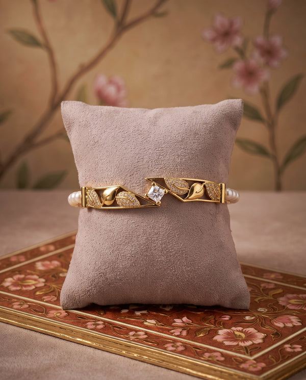 Gold Plated Pearl Bangle with Pavé Leaf & Solitaire CZ Canter