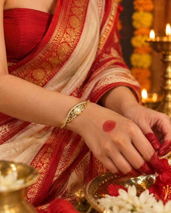 Gold-Tone Wave Bangle with Solitaire Pearl