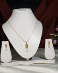 The Pretty Pendant Set by Chandrani Pearls India features elegant leaf-shaped pendants with pearl drops, styled on a white jewelry stand—an exquisite choice to enhance any ensemble. (Chain used for photographic purpose.).
