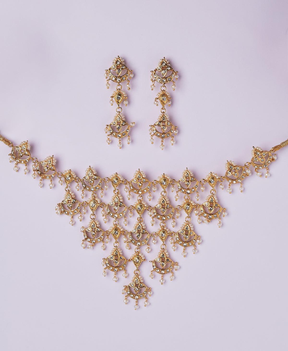Gorgeous and Trendy AD Stone and Pearl Studded Set - Chandrani Pearls