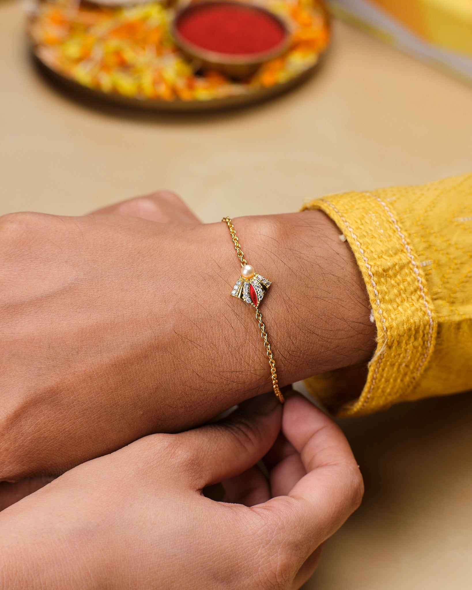 Sparkling Cute Pearl Stud Rakhi for Bhaiya