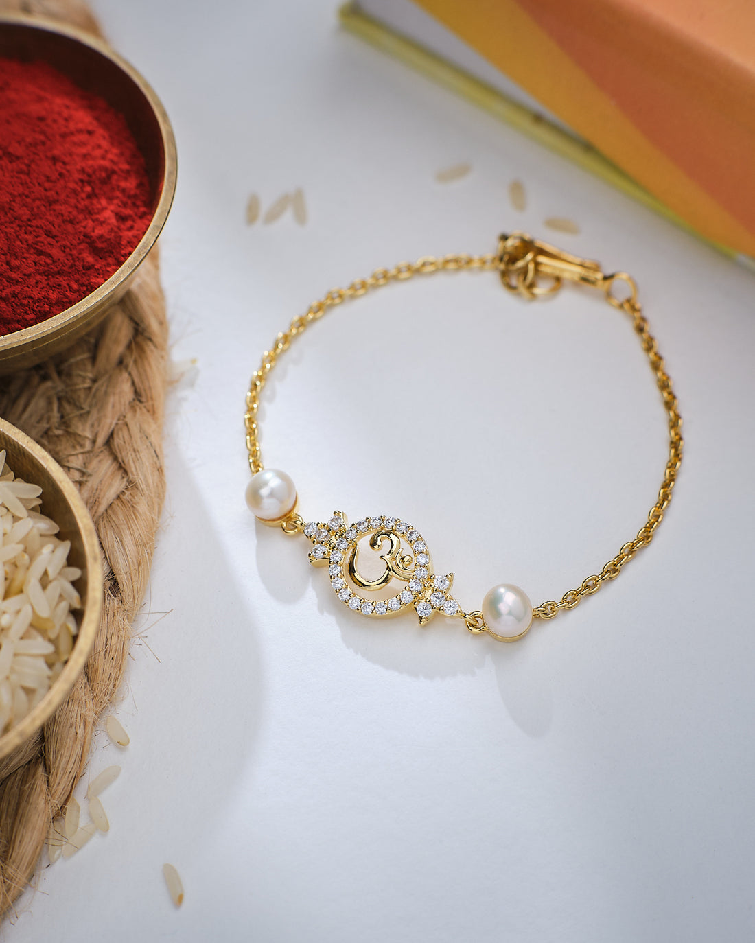 Charming OM Pearl Cute Rakhi for Brother