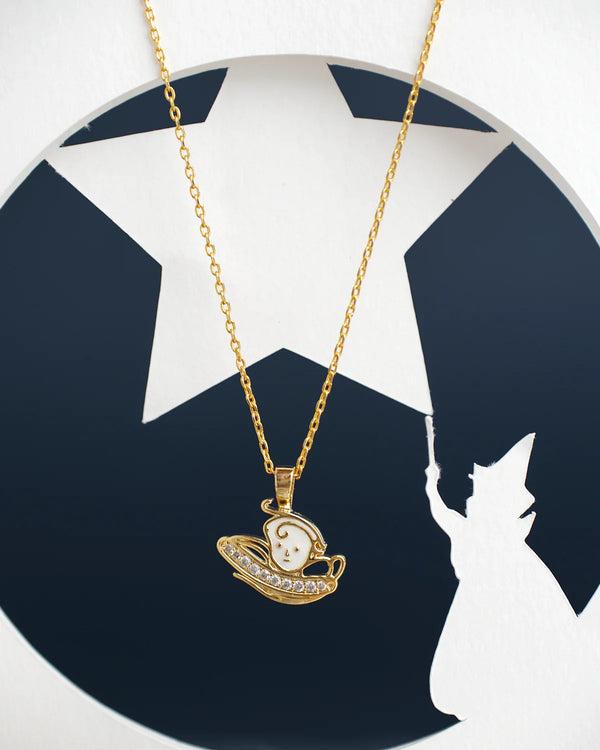 The Kiddie Pretty Pendant by Chandrani Pearls India features a gold necklace with a pendant of a lady in a hat against a starry background, including the silhouette of a wizard with a wand.