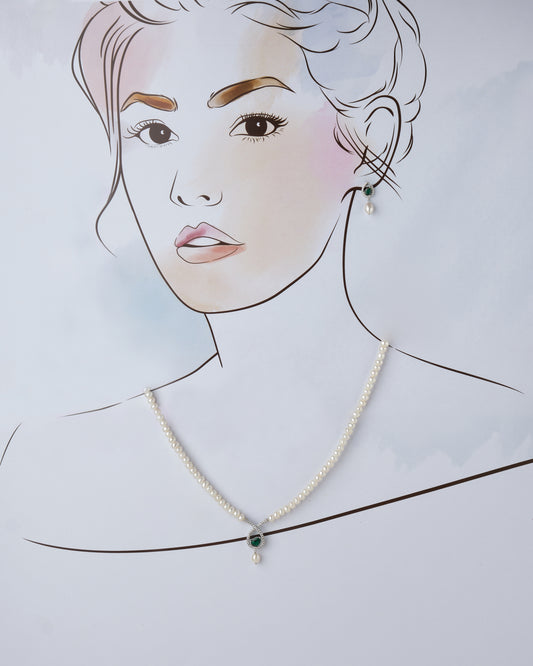 A drawing of a woman wearing a Lyrical Tear Drop Pearl Necklace Set and earrings by Chandrani Pearls.